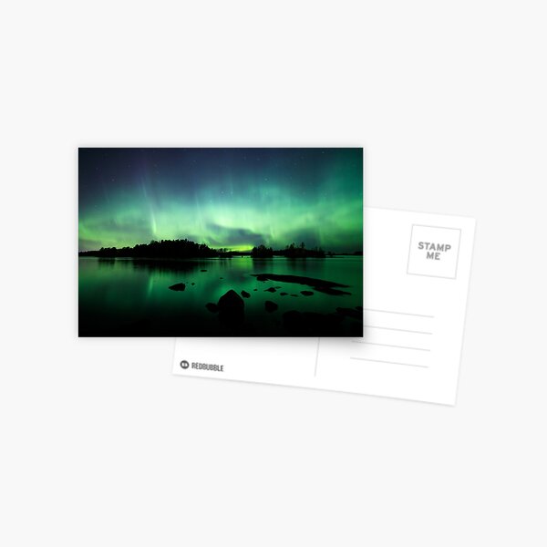 Beautiful northern lights over lake Postcard