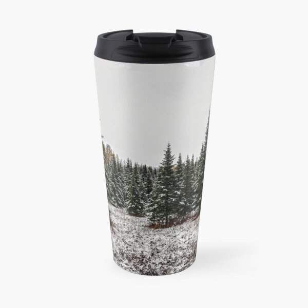 snow on evergreen trees Travel Mug