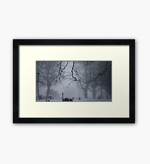 A misty churchyard Framed Print