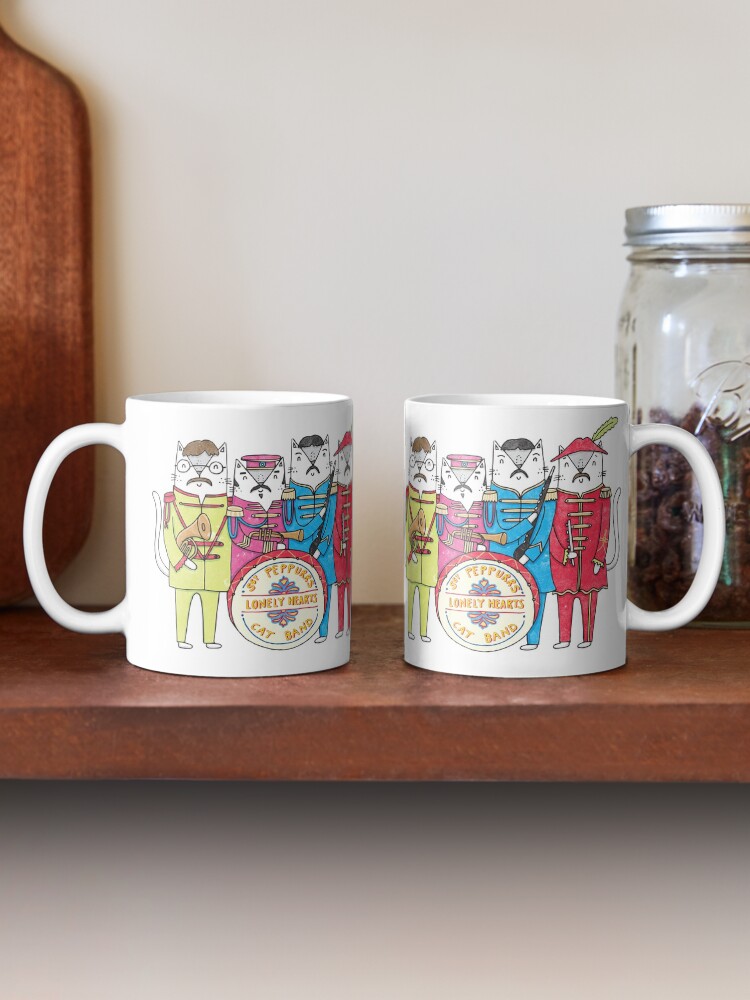 Aperçu 2 sur 6. Mug à café avec l'œuvre Le groupe Lonely Hearts Cats du SGT Peppurr créée et vendue par KatieRubyMiller.