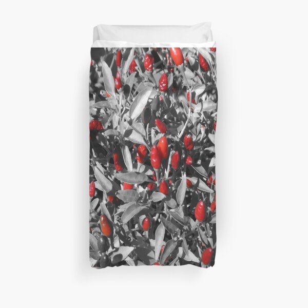 Red chillies on black and white Duvet Cover