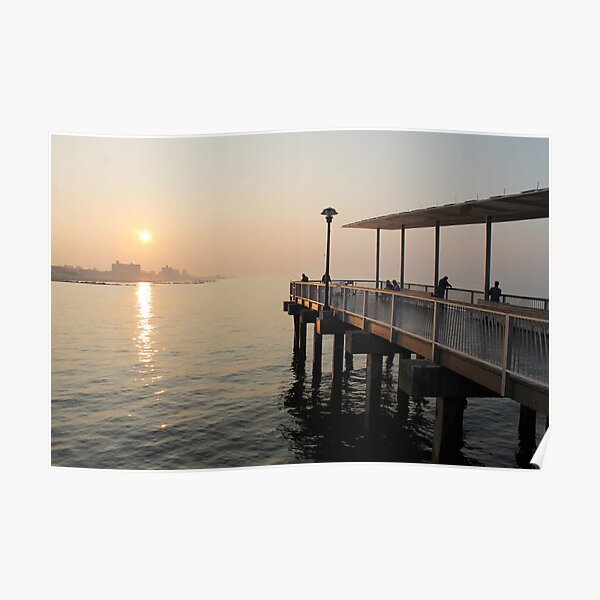 #sunset #water #sea #pier #beach #dusk #reflection #sky #lake #outdoors #landscape #horizontal #yellow #colorimage #sunrisedawn #nopeople #sun #sunny #watersedge #coastline #nonurbanscene Poster