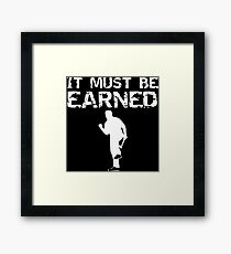 it must be earned Framed Print