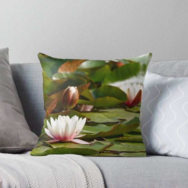 Item preview, Water lily in a pond surrounded by leaves designed and sold by BiceksPhoto.