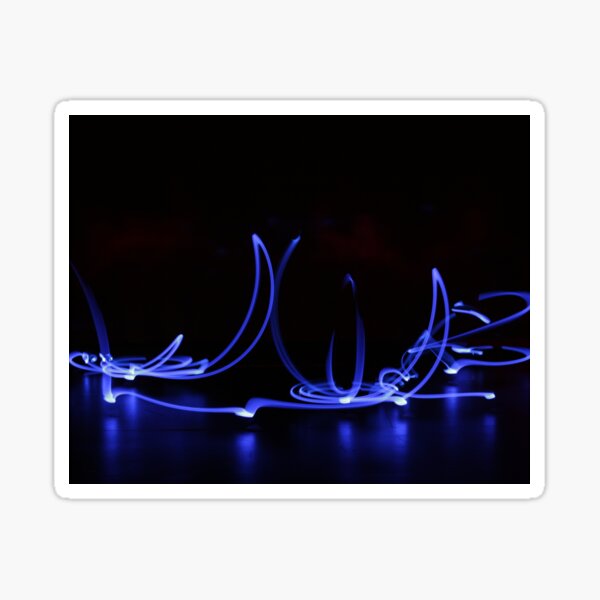 Blue lights whirling on a black background Sticker
