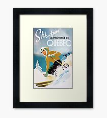 Vintage ski poster, woman skiing in Quebec Framed Print