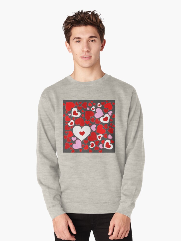 white sweatshirt with red hearts