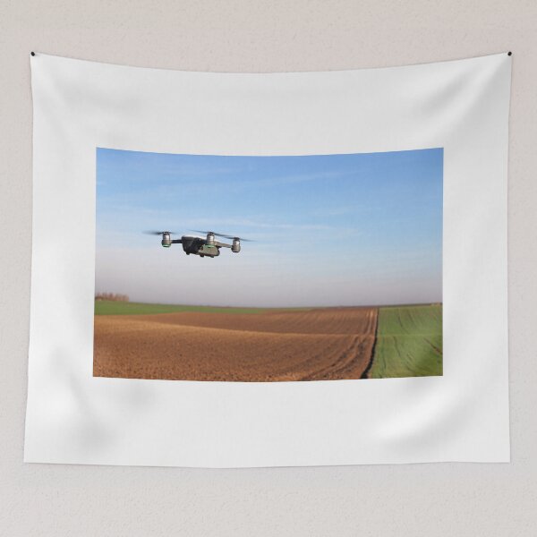 Item preview, The drone is flying over the plowed field designed and sold by goceris.