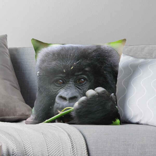 Gorilla male silverback great ape of Africa sitting in green jungle bushes  Throw Pillow