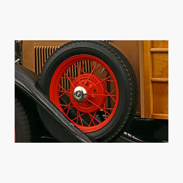 Old-fashioned firetruck wheel Photographic Print