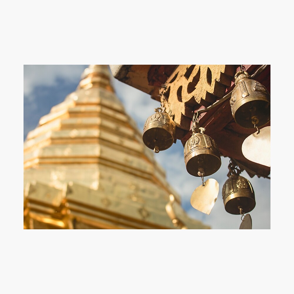 Beautiful copper bells, with blurred stupa in background in Doi Suthep  temple.