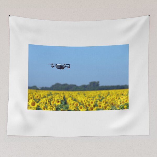 Item preview, The drone is flying over the sunflower field summer season designed and sold by goceris.