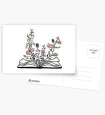 flowers growing from book Postcards