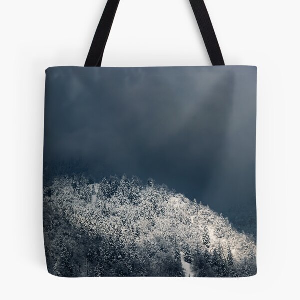 Item preview, Darkness and sun over snowy spruce forest designed and sold by Patrik Lovrin.