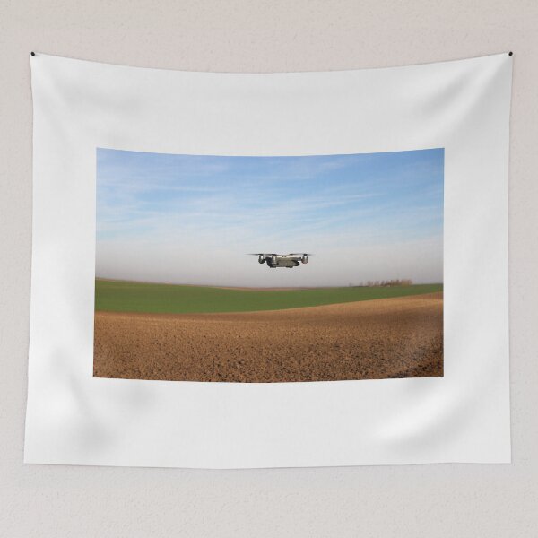 Item preview, The drone is flying over the plowed field agriculture designed and sold by goceris.