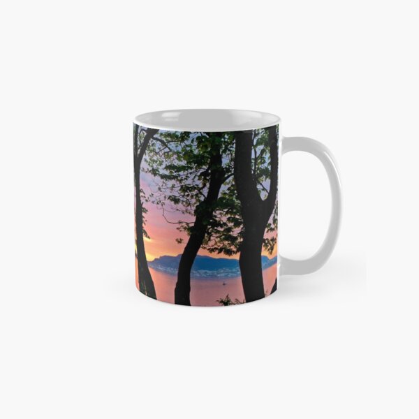 Striking sunset behind trees Classic Mug