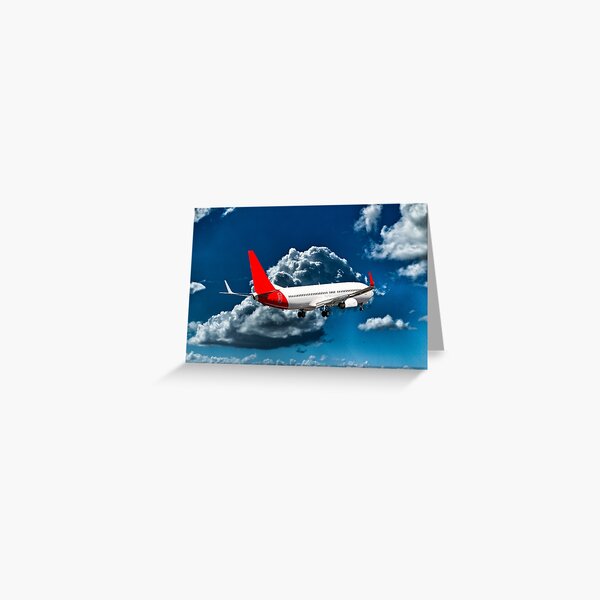 Commercial Aircraft in flight with cloud in blue sky. Greeting Card