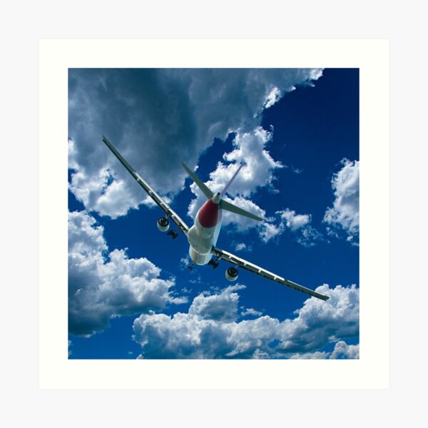 Commercial Aircraft in flight with cloud in blue sky. Art Print
