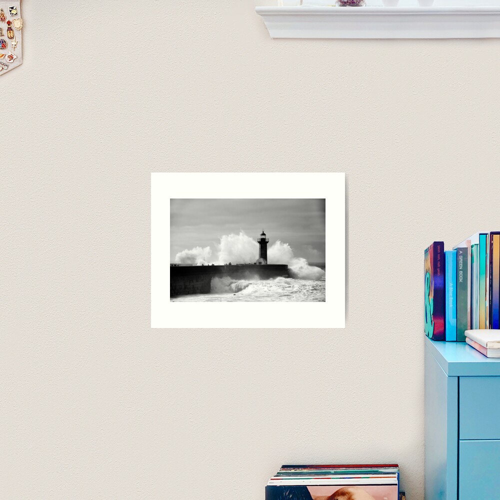 Lighthouse in stormy ocean Art Print