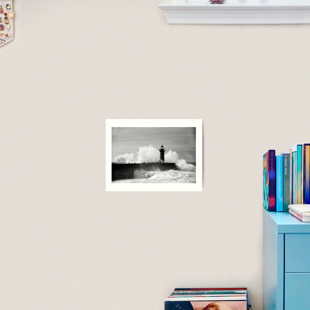 Lighthouse in stormy ocean Art Print
