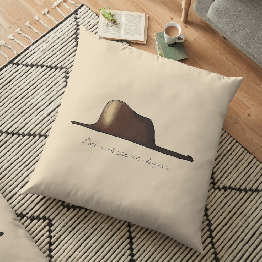 Ceci ne pas un petit chapeau Floor Pillow