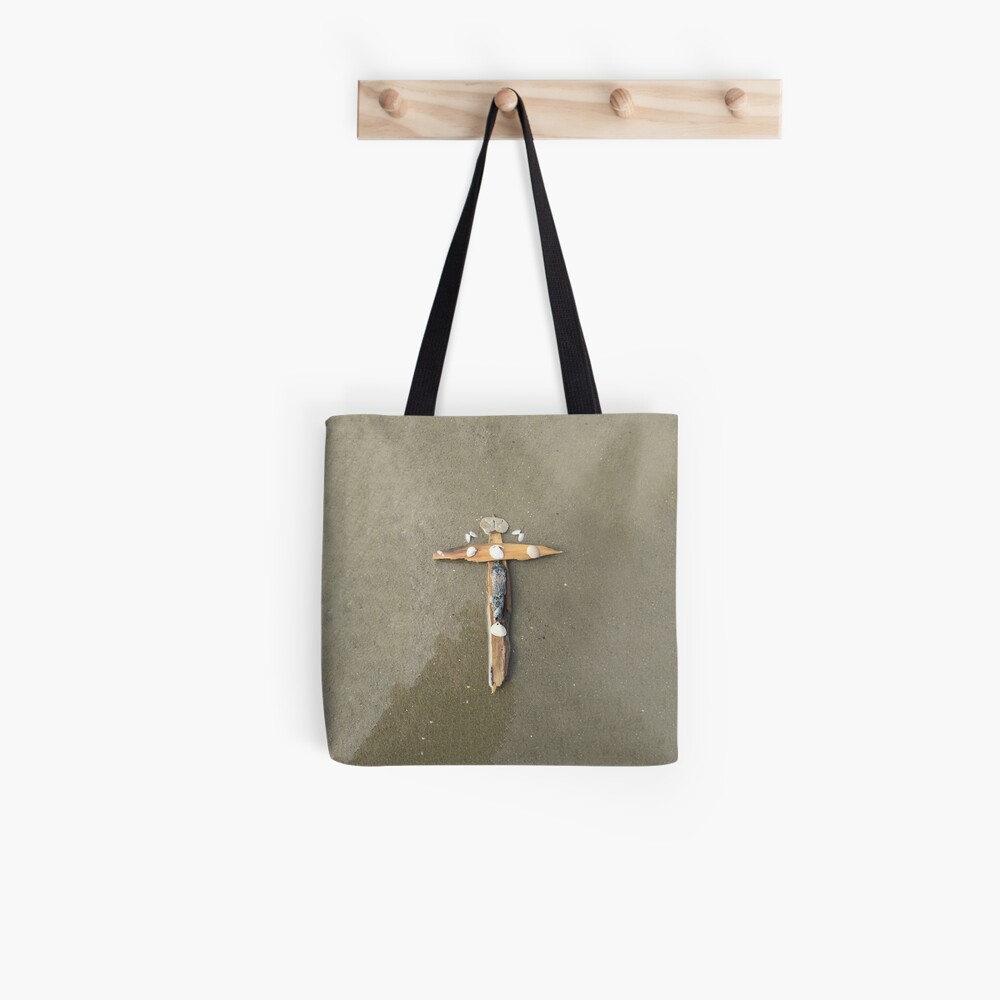 Driftwood cross on beach sand - From ccnow.info Tote Bag