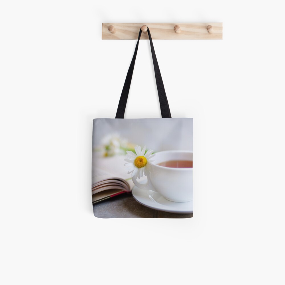 a good book should leave you slightly exhausted at the end. You live several lives while reading it... Tote Bag