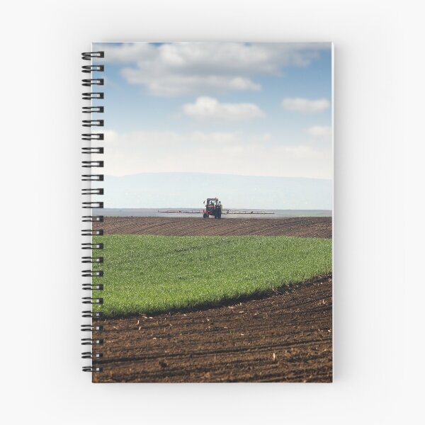 Item preview, tractor spraying field at spring agriculture rural landscape designed and sold by goceris.