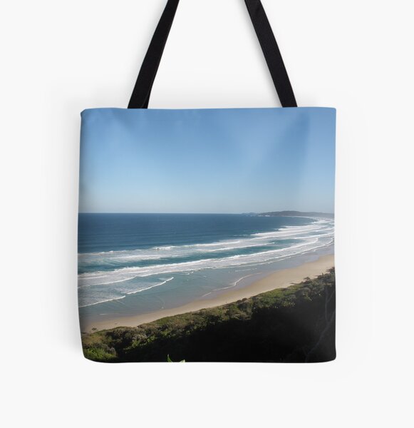 A crowded beach at Byron bay NSW. All Over Print Tote Bag