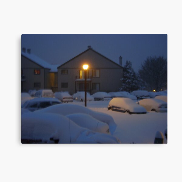 Warm Glow on a Cold Snowy night Canvas Print