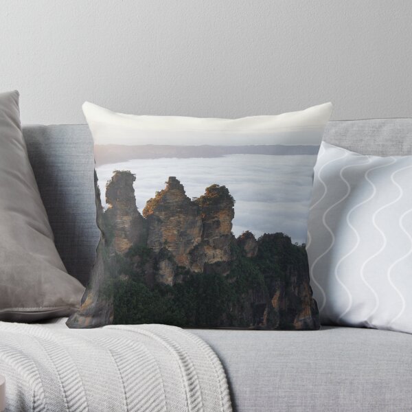 Three sisters view a misty valley Throw Pillow