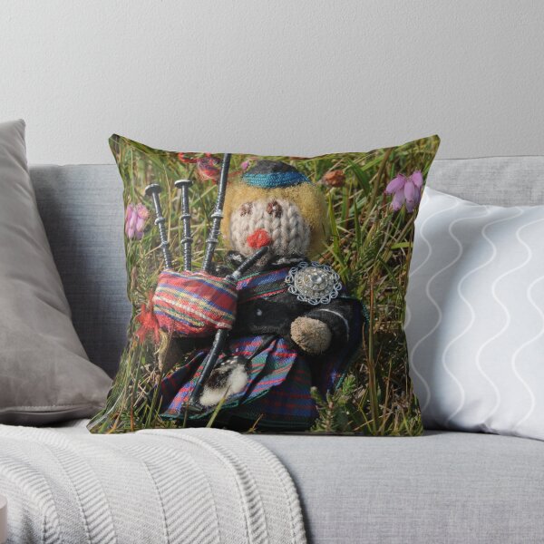 Scotty plays the Pipes beside the Cross-leaved Heath Throw Pillow