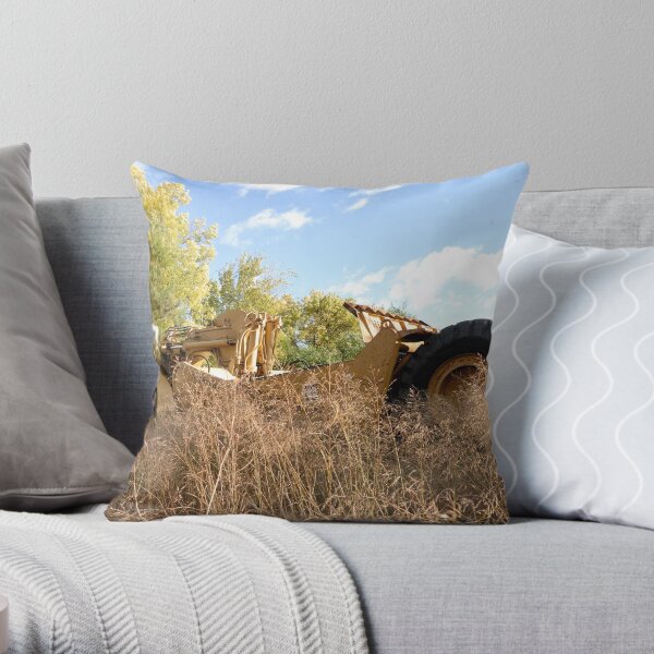 Land Grader parked in the grass Throw Pillow