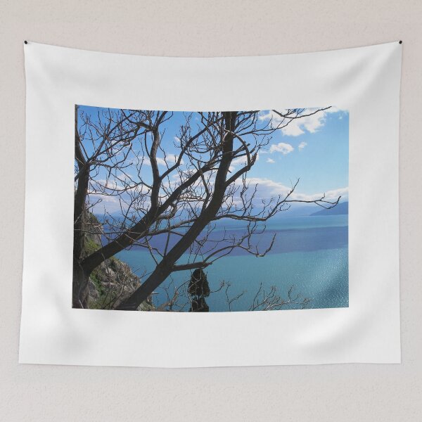 Item preview, sea blue behind bare tree designed and sold by tbshots.