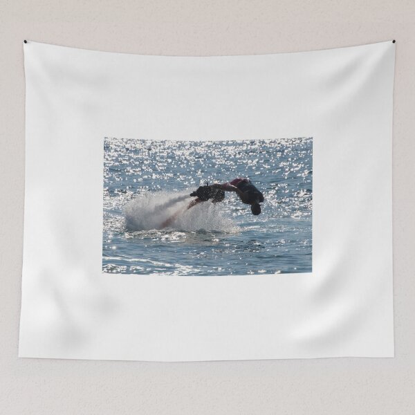 Item preview, Flyboarder diving forwards headfirst into backlit sea designed and sold by Nick Dale Photography.