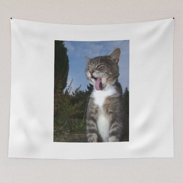 Item preview, Tabby cat licking fur in garden designed and sold by turniptowers.