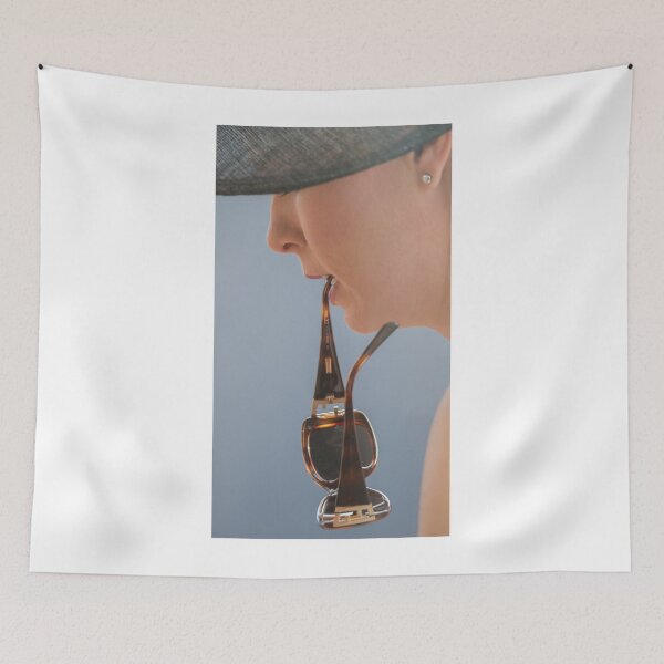 Item preview, Woman in hat holding sunglasses between teeth designed and sold by Nick Dale Photography.