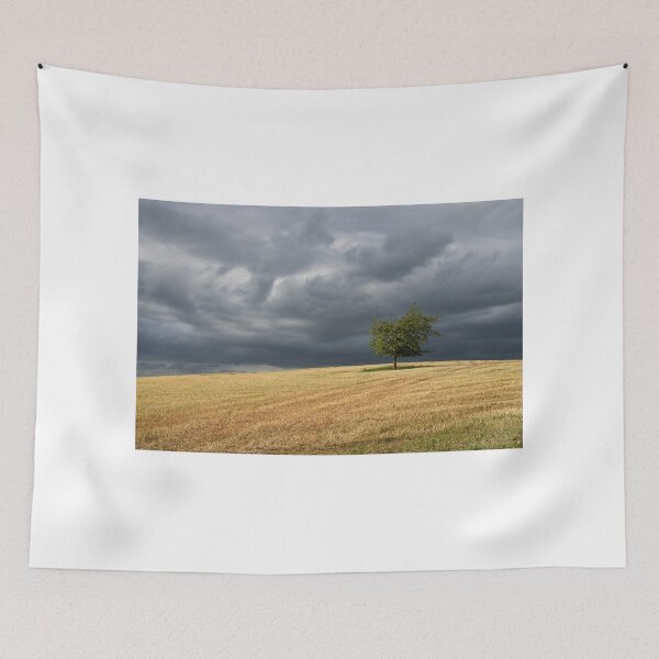 Item preview, Stormy clouds over a lone tree designed and sold by Pete Hemington.