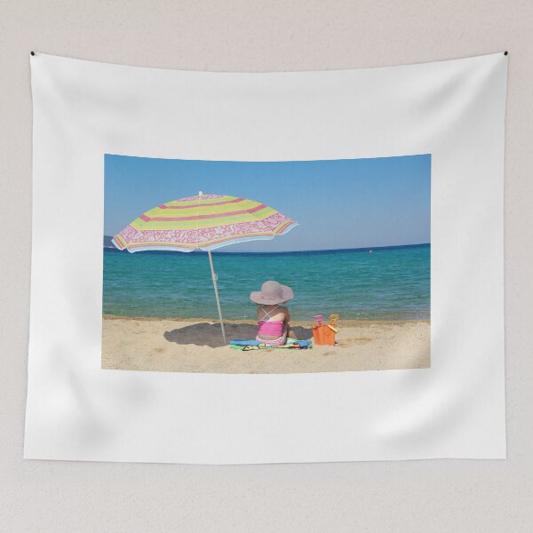 Item preview, little girl sitting on beach under sunshade designed and sold by goceris.