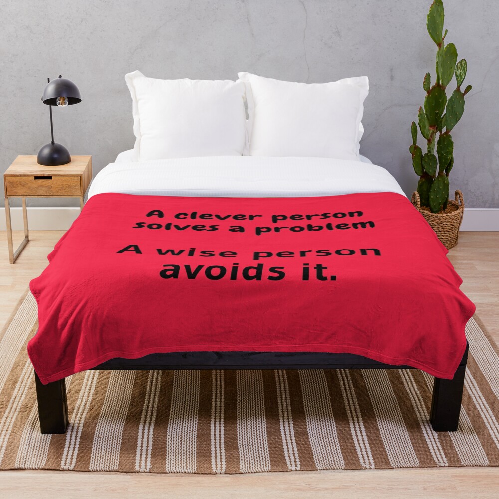 A clever person solves a problem, A wise person avoids it. Throw Blanket
