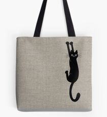 Schwarze Katze, die an hält Tote Bag