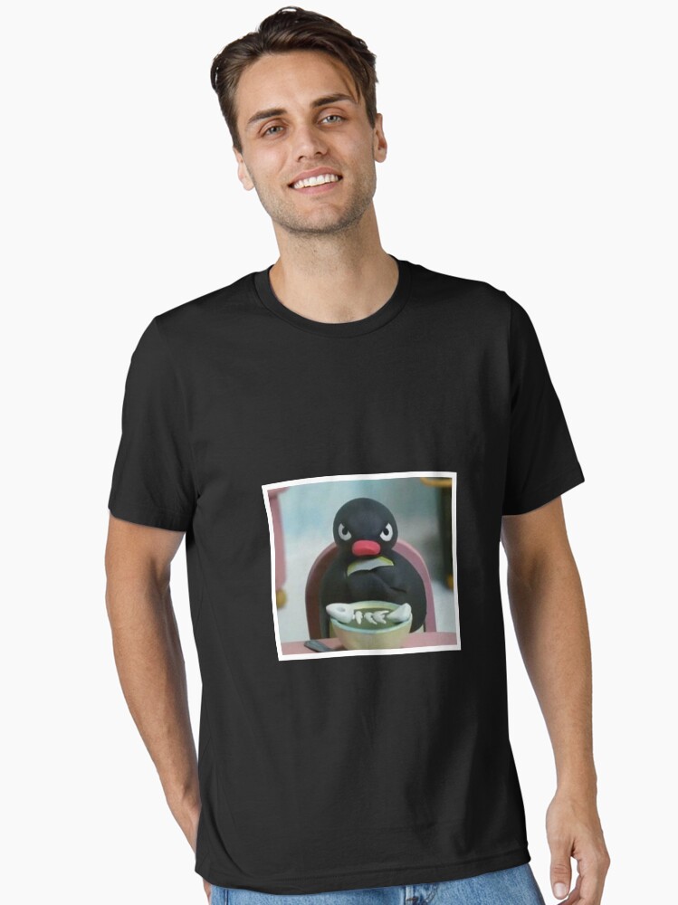 Imagen 1 de 7, Camiseta esencial con la obra Pingu The Penguin Angry - Noot Noot, diseñada y vendida por Luseres.