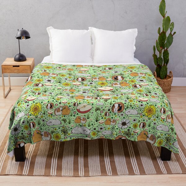 Guinea Pigs in Green Throw Blanket
