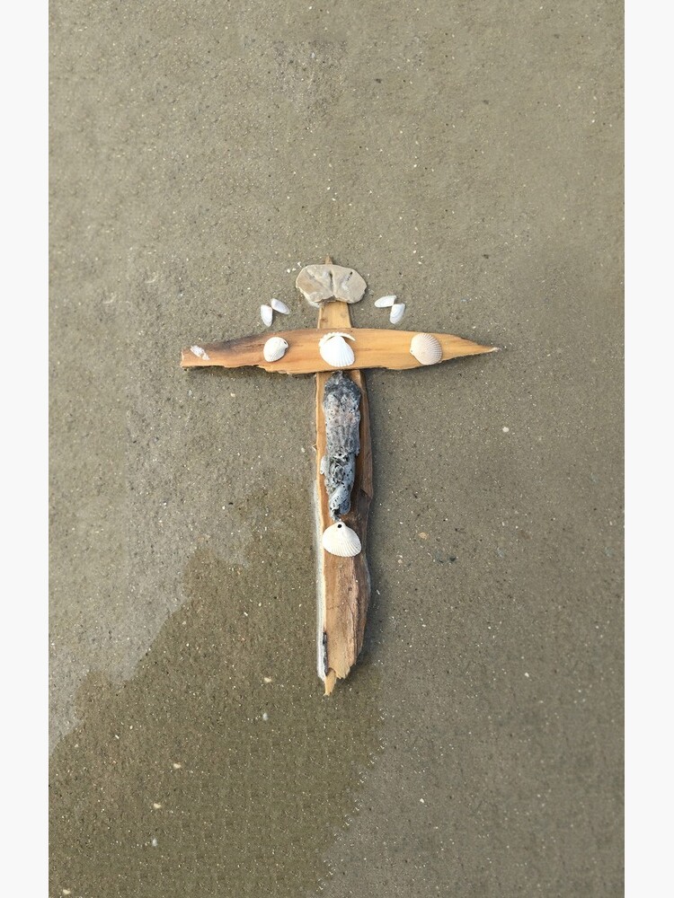 Driftwood cross on beach sand - From ccnow.info by sdawsoncc