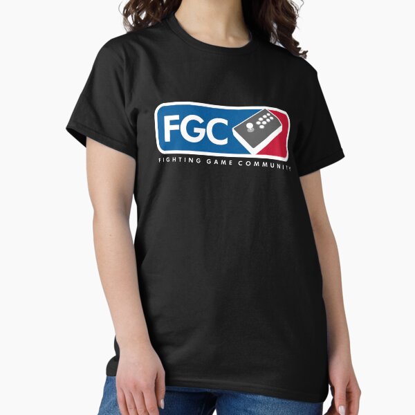 Artikel-Vorschau von  Wir sind alle Teil derselben Gemeinschaft. Stellen Sie die gesamte FGC mit einem Shirt dar ... nun, außer für Pad-Spieler ¯ \ _ (ツ) _ / ¯. Der Erlös dient der Deckung der zunehmend exorbitanten DLC-Kosten für Saisonkarten, designt und verkauft von NerdGame +.