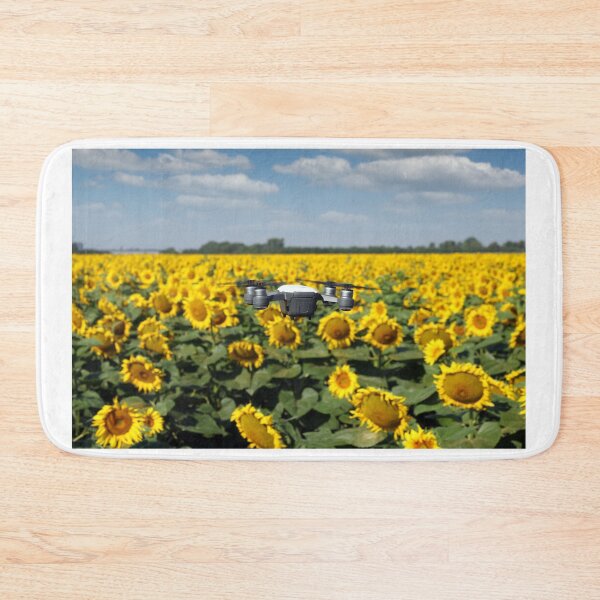 Item preview, The drone is flying over the sunflower field in summer designed and sold by goceris.