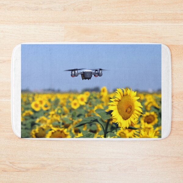 Item preview, The drone is flying over the sunflower field technology and agriculture designed and sold by goceris.