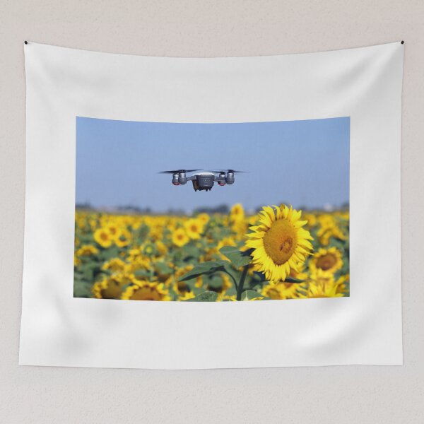 Item preview, The drone is flying over the sunflower field technology and agriculture designed and sold by goceris.