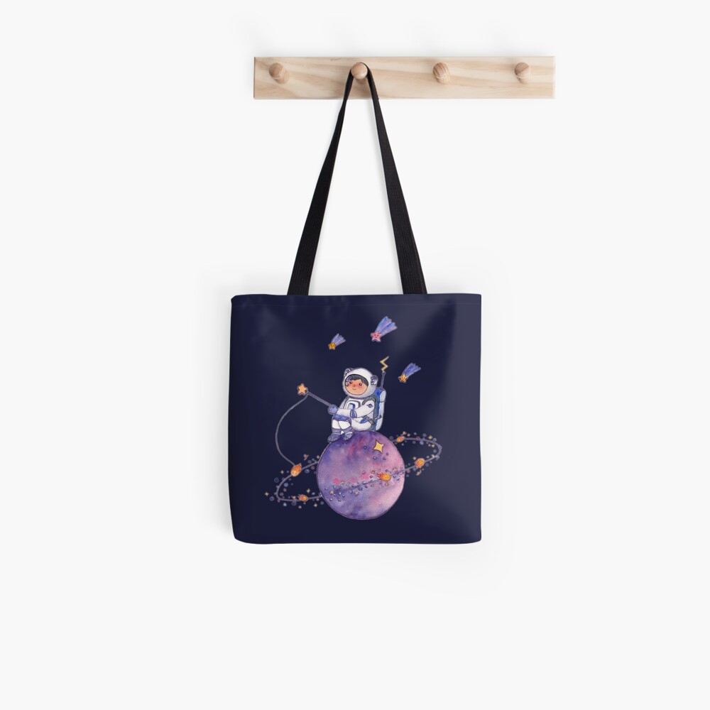 Astronaut catching Asteroids on a Star Tote Bag