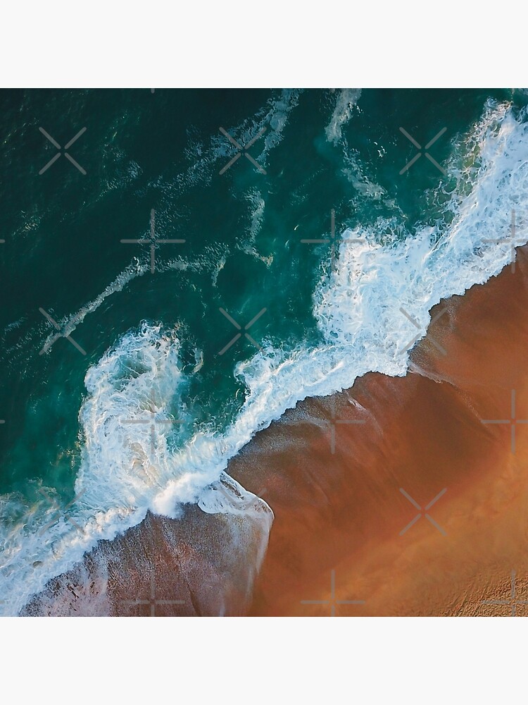 Sea waves washing up on sand beach